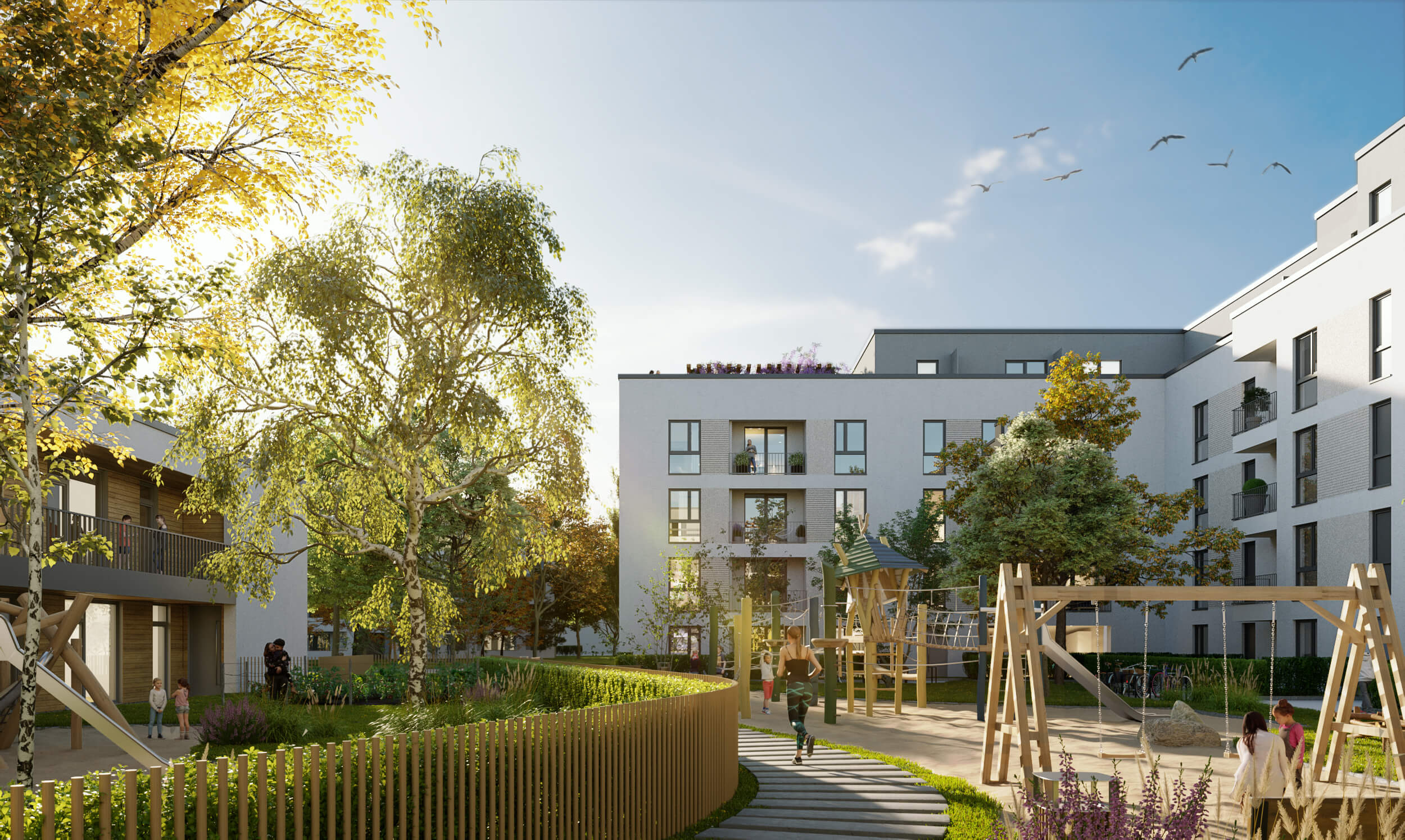 Innenhof einer modernen Wohnanlage mit Spielplatz, Bäumen und spielenden Kindern bei Sonnenschein